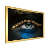DesignArt 'Djevojke oči sa zlatnim lancem i plavim pigmentom' Moderni uokvireni umjetnički tisak